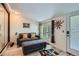 Cozy living room with a comfortable sofa, natural light, and stylish decor at 1701 Kingston St, Aurora, CO 80010