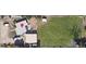 An aerial view shows the property with an expansive green lawn and multiple outbuildings at 1020 Kipling St, Lakewood, CO 80215