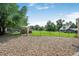 Spacious backyard with grassy area, shed, and gravel landscaping at 1020 Kipling St, Lakewood, CO 80215