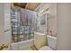 Bathroom featuring a shower with black and white curtain, tile flooring, and vanity with a sink at 1020 Kipling St, Lakewood, CO 80215