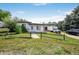 Charming single-story home featuring a well-maintained lawn, rustic fence, and a bright white exterior paint at 1020 Kipling St, Lakewood, CO 80215