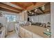 Kitchen with ample countertop space, appliances, and wooden beam ceiling at 1020 Kipling St, Lakewood, CO 80215