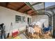 Bright sunroom featuring a wooden ceiling, ceiling fan, and a washer and dryer at 1020 Kipling St, Lakewood, CO 80215
