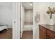 This bathroom with a shower over the tub is accessible through the bedroom at 1703 S Grant S St, Denver, CO 80210