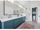 Stylish primary bathroom with double vanity, modern fixtures, a glass shower, and a separate water closet at 1703 S Grant S St, Denver, CO 80210