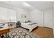This basement bedroom features a bed, desk, chair, and closet at 1703 S Grant S St, Denver, CO 80210