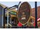 Inviting coffee shop with outdoor seating and a charming sign advertising coffee, tea & accessories at 1703 S Grant S St, Denver, CO 80210