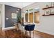 Bright dining room featuring modern light fixture, large window, and elegant decor at 1703 S Grant S St, Denver, CO 80210