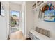Bright entryway with storage bench, shelving, and a view of the outdoor patio at 1703 S Grant S St, Denver, CO 80210