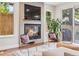 Cozy living room with a fireplace, TV, modern chairs and access to the outdoors at 1703 S Grant S St, Denver, CO 80210