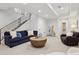 This living room offers a seating area and stairs to the upper level at 1703 S Grant S St, Denver, CO 80210