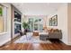 Cozy living room features a fireplace, hardwood floors, and stylish decor and a sliding glass door at 1703 S Grant S St, Denver, CO 80210