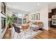 Comfortable living room with hardwood floors, a fireplace, and access to the outdoor space at 1703 S Grant S St, Denver, CO 80210