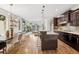 Open concept living space blending kitchen, dining, and living areas with abundant natural light at 1703 S Grant S St, Denver, CO 80210