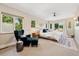 Bright and airy main bedroom with large windows, a private deck, and calming decor at 1703 S Grant S St, Denver, CO 80210