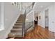 Beautiful staircase with modern railing and hardwood floors leading to upper level at 1703 S Grant S St, Denver, CO 80210