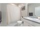 Well-lit bathroom with a vanity, modern fixtures, and a shower with a decorative curtain at 21574 E 59Th Dr, Aurora, CO 80019