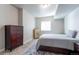 Cozy bedroom with a neutral palette, a large window for natural light, and ample closet space at 21574 E 59Th Dr, Aurora, CO 80019