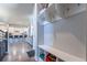 Welcoming entryway with built-in shelves, coat hooks, and a view into the open-concept living space at 21574 E 59Th Dr, Aurora, CO 80019