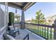 Relaxing front porch with seating, providing a tranquil outdoor space with views of the neighborhood at 21574 E 59Th Dr, Aurora, CO 80019