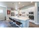Spacious kitchen showcasing an island, stainless steel appliances, and ample storage with modern cabinetry at 21574 E 59Th Dr, Aurora, CO 80019