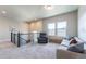 Comfortable living room with lots of light and a view of the stairway at 21574 E 59Th Dr, Aurora, CO 80019