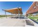 Outdoor picnic area with large sun shelter, grilling stations and ample seating at 21574 E 59Th Dr, Aurora, CO 80019
