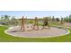 Playground swingset with a soft surface, nestled into the surrounding community landscape at 21574 E 59Th Dr, Aurora, CO 80019