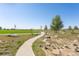 Picturesque community walking path near lush green space and playground at 21574 E 59Th Dr, Aurora, CO 80019