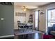 Charming dining area with hardwood floors, a table set for four, and decorative wall art at 19930 E Cornell Ave, Aurora, CO 80013