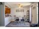 Bright dining space with a set table for four and an open view to the kitchen, creating a seamless flow at 19930 E Cornell Ave, Aurora, CO 80013