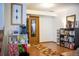 Functional hallway with storage shelves, decor and tile flooring at 19930 E Cornell Ave, Aurora, CO 80013