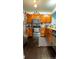 Functional kitchen featuring stainless steel appliances, ample cabinetry, and sleek black and white patterned rug at 19930 E Cornell Ave, Aurora, CO 80013