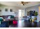 Inviting living room with hardwood floors, a comfortable sofa, and natural light, perfect for relaxation at 19930 E Cornell Ave, Aurora, CO 80013