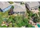Aerial view of a home with a spacious yard, mature trees, and surrounding neighborhood at 2950 Wyecliff Ln, Highlands Ranch, CO 80126