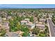 Aerial view showcases homes nestled among lush trees in this established neighborhood at 2950 Wyecliff Ln, Highlands Ranch, CO 80126
