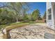 Spacious backyard with a patio area, mature trees, and a well-maintained lawn at 2950 Wyecliff Ln, Highlands Ranch, CO 80126
