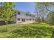 Large fenced backyard with lush lawn and patio, perfect for outdoor entertaining at 2950 Wyecliff Ln, Highlands Ranch, CO 80126