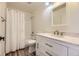 This full bathroom features a shower over tub with white subway tile and modern vanity at 2950 Wyecliff Ln, Highlands Ranch, CO 80126