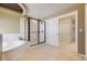 Well-lit bathroom features a separate tub and shower area, showcasing elegance and functionality at 2950 Wyecliff Ln, Highlands Ranch, CO 80126