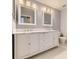 Updated bathroom features a double sink vanity with marble countertop and ample storage at 2950 Wyecliff Ln, Highlands Ranch, CO 80126