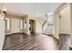 Inviting entryway with hardwood floors, staircase, and views of the living spaces at 2950 Wyecliff Ln, Highlands Ranch, CO 80126