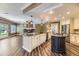 Bright kitchen featuring granite countertops, stainless steel appliances, and a large island with a cooktop at 2950 Wyecliff Ln, Highlands Ranch, CO 80126