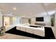 Spacious basement living room with recessed lights, large TV and an L-shaped couch at 2950 Wyecliff Ln, Highlands Ranch, CO 80126