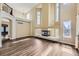 Open floor plan with high ceilings, abundant natural light, fireplace, and view of the home's upper level at 2950 Wyecliff Ln, Highlands Ranch, CO 80126