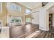 Open concept living space featuring hardwood floors, high ceilings, large windows, and a view of the loft at 2950 Wyecliff Ln, Highlands Ranch, CO 80126