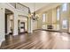 Expansive living room with hardwood floors, fireplace, high ceilings, and staircase at 2950 Wyecliff Ln, Highlands Ranch, CO 80126