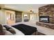 View of the main bedroom from the bed featuring a stone fireplace at 2950 Wyecliff Ln, Highlands Ranch, CO 80126