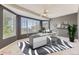 Modern office with large windows and ceiling fan at 2950 Wyecliff Ln, Highlands Ranch, CO 80126