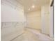 Bright walk-in closet with multiple levels of shelving for ample storage at 2950 Wyecliff Ln, Highlands Ranch, CO 80126